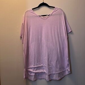 Light pink dry tech workout shirt with crisscross detail front